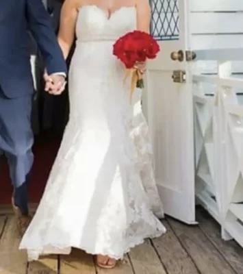 Wedding dress, size 12 had the top half altered. More then welcome to come view