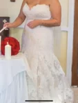 Wedding dress, size 12 had the top half altered. More then welcome to come view