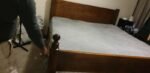 King size wooden bed and mattress
