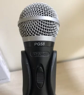 Shure PG58 wired microphone, with lead and desk stand